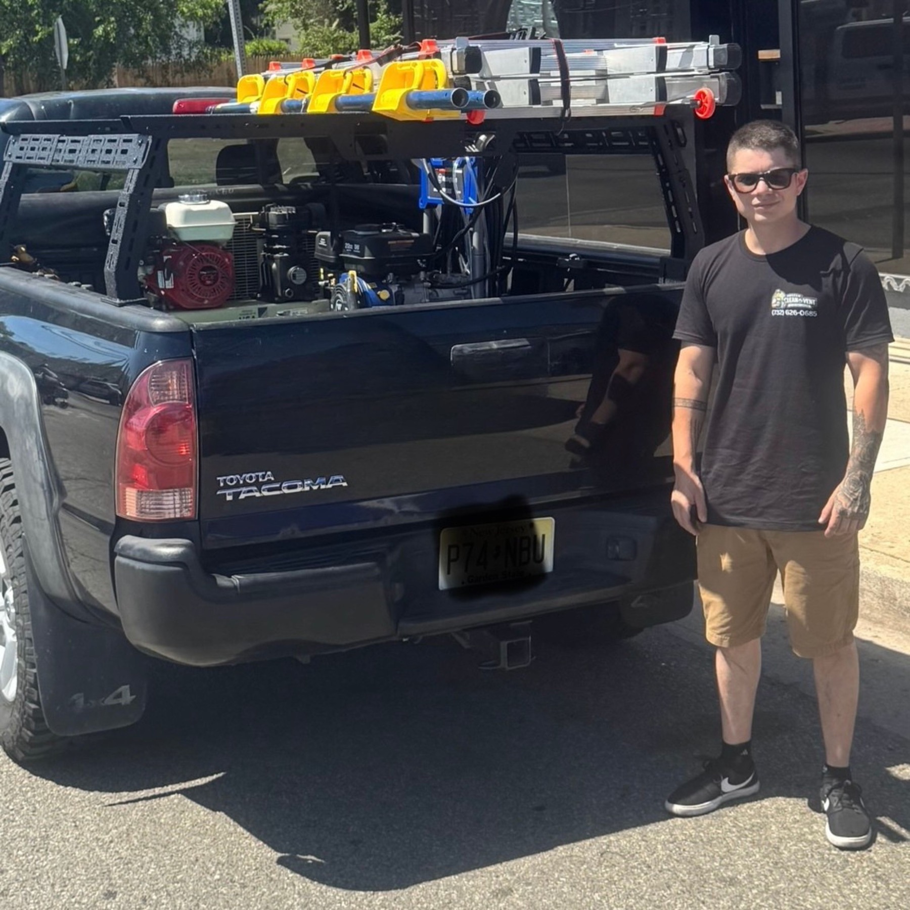 Joshua Esquivel, owner of Mister Clean My Vent, standing beside his work truck