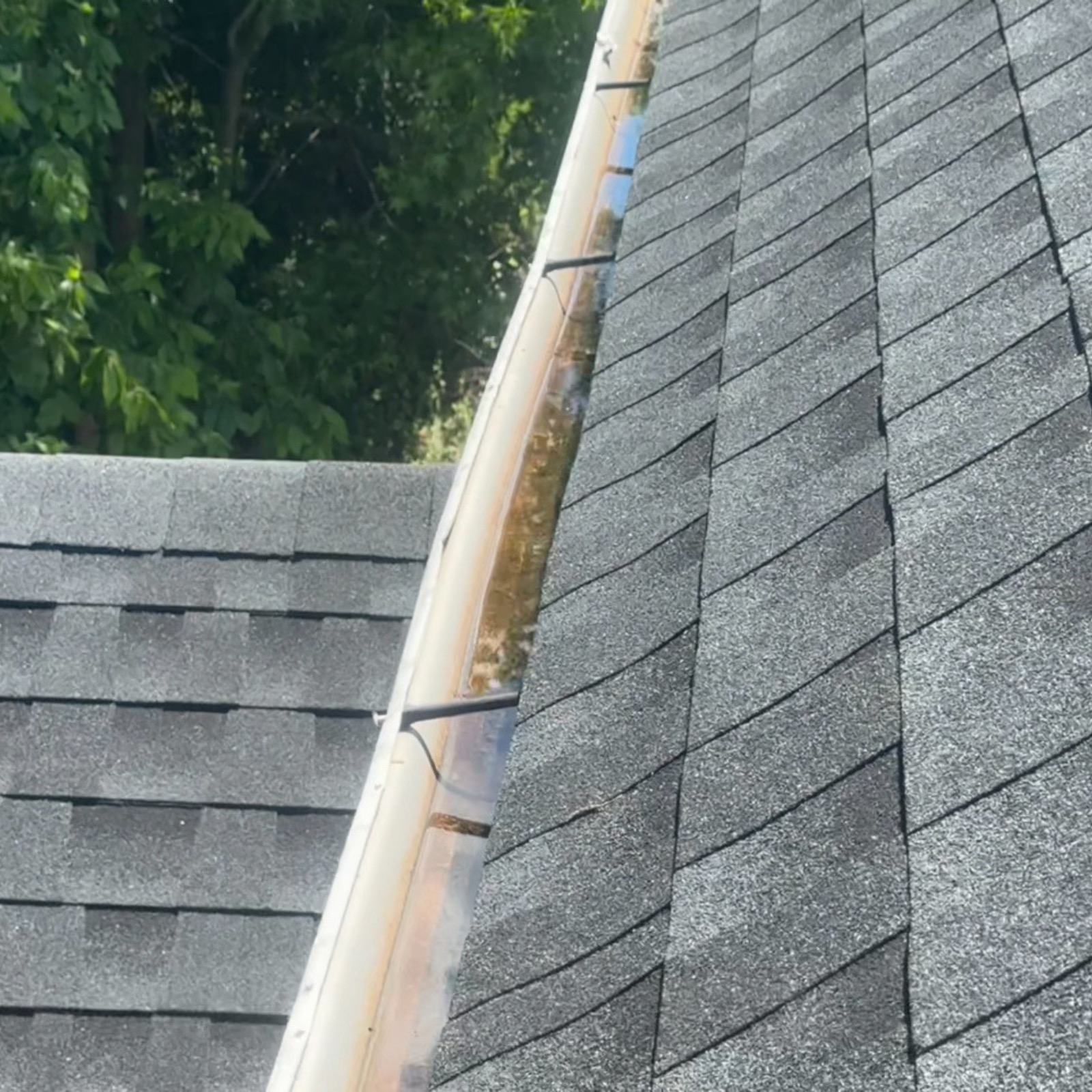 Gutter with buildup before cleaning