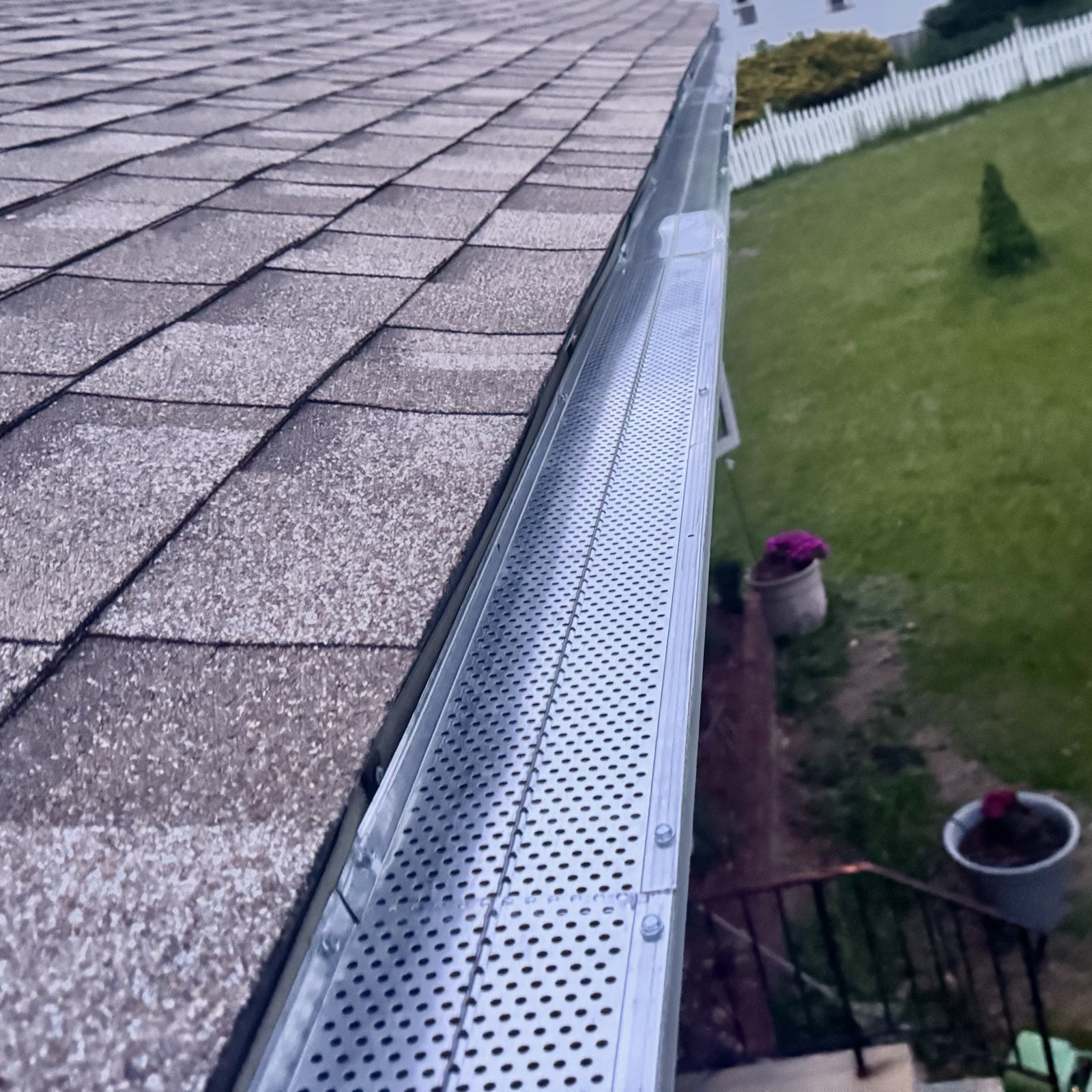 Gutter guard installed on a roof gutter